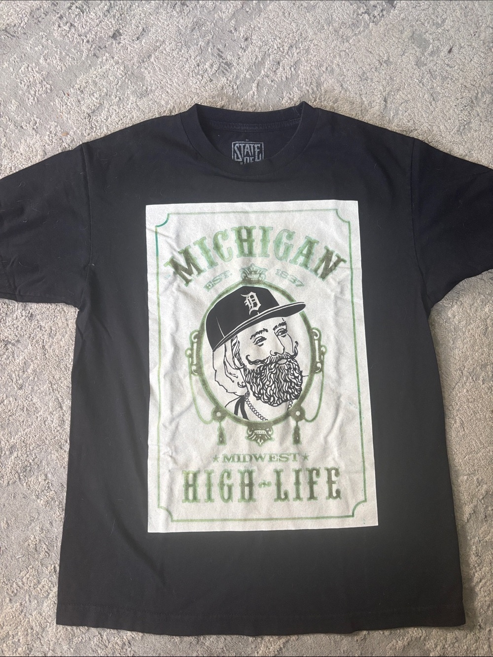 STATE Black Tee with Green Michigan High-Life Graphic